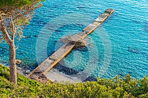 Idyllic view of bay with jetty and blue sea water