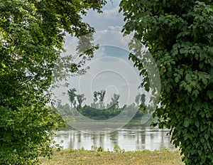 Idyllic view of the Missouri river between two lush trees