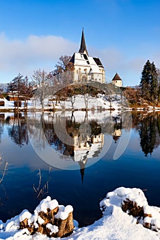 Idyllic view of the pilgrimage church and in Maria Worth in winter, Carinthia, Austria. Pfarrkirche Mariae Himmelfahrt, Ã–