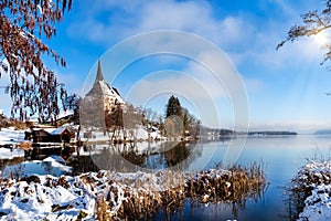 Idyllic view of the pilgrimage church and in Maria Worth in winter, Carinthia, Austria. Pfarrkirche Mariae Himmelfahrt, Ã–