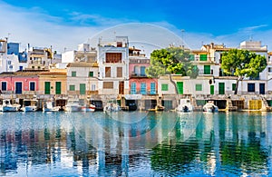 Idyllic view of Portocolom harbour with colorful houses at waterfront, Majorca Spain