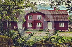 An idyllic vintage Swedish house among the trees.
