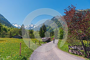 Idyllic walkway from oberstdorf to spielmannsau village, trettach valley in the allgau alps photo