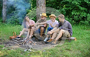 Idyllic weekend. Friends enjoy weekend barbecue in forest. Group friends spend leisure weekend hike picnic forest nature