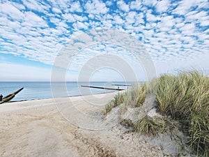 Idyllic white beach with blue skies and dunes
