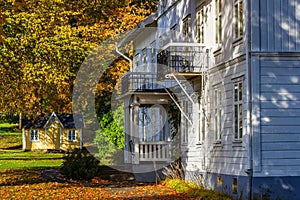 Idyllic wooden house in a park with autumn colors