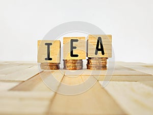 IEA text on wooden blocks background. Stands for International Energy Agency. Stock photo.