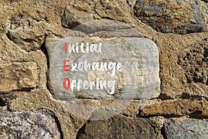 IEO initial exchange offering symbol. Concept words IEO initial exchange offering on beautiful big stone. Beautiful stone wall