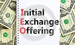 IEO initial exchange offering symbol. Concept words IEO initial exchange offering on beautiful note. Beautiful dollar bills