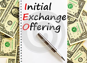 IEO initial exchange offering symbol. Concept words IEO initial exchange offering on beautiful note. Beautiful dollar bills