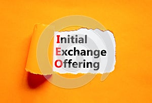 IEO initial exchange offering symbol. Concept words IEO initial exchange offering on beautiful paper. Beautiful orange paper