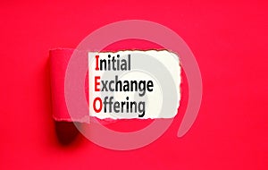 IEO initial exchange offering symbol. Concept words IEO initial exchange offering on beautiful paper. Beautiful red paper