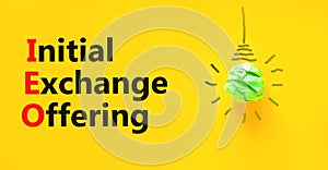 IEO initial exchange offering symbol. Concept words IEO initial exchange offering on beautiful paper. Beautiful yellow paper
