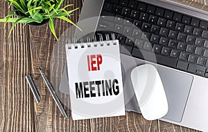IEP MEETING text on notebook with laptop, mouse and pen