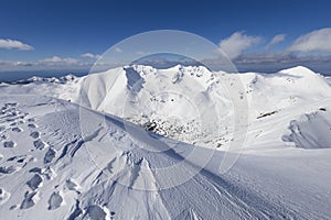 iew from Baranec, Western Tatras, Slovakia. Beautiful winter landscape of mountains is covered by snow in wintertime. photo