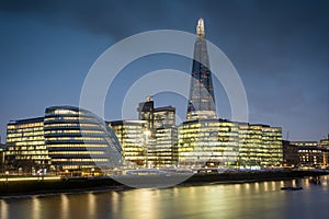 Iew over the Thames as night falls, taking in The Scoop, The Shard and City Hall