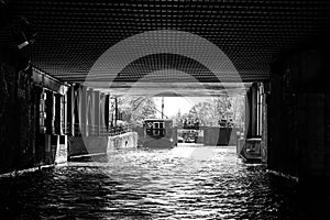 iew under a bridge from a boat on Amsterdam canal photo