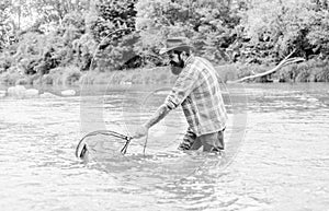 If fish regularly you know how rewarding and soothing fishing is. Bearded brutal fisher catching trout fish with net