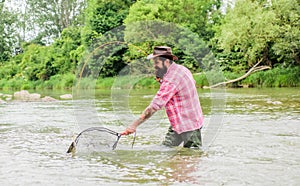 If fish regularly you know how rewarding and soothing fishing is. Fishing hobby. Bearded brutal fisher catching trout