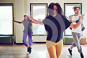 If life is the question, dance is the answer. a group of young people dancing together in a studio.