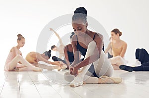 If someone understands, good. If not, no matter. a group of young ballerinas preparing for their routine.