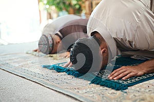 If you do not expect, you will not have. a young muslim couple and their son praying in the lounge at home.