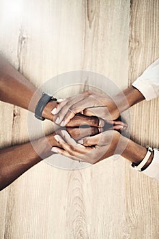 If you need me youve got me. Cropped high angle shot of a man and woman holding hands at a table.