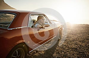 If youre looking for me, Im out on an adventure. a young woman enjoying a road trip along the coast.