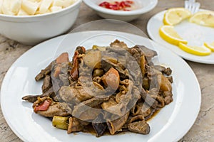 Igado, a Filipino spiced pork dish made with liver, tenderloin, innards and vegetables. Ilocano cuisine
