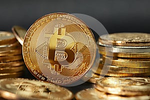 Igital Currency. Gold Bitcoin Coins On Dark Background