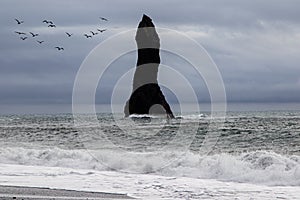 Igneous rock structure in ocean.