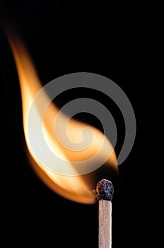 Ignition of a match, on black background.