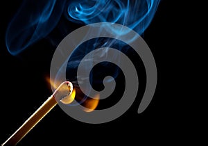 Ignition of match with smoke photo