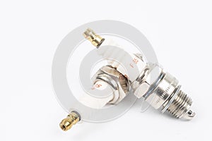 Ignition spark plug with platinum electrode. Automotive parts isolated above white background