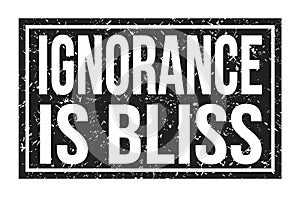 IGNORANCE IS BLISS, words on black rectangle stamp sign