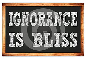 IGNORANCE IS BLISS words on black wooden frame school blackboard