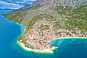 Igrane village on Makarska riviera and Biokovo mountain aerial view
