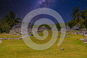 Iguana lizard in ancient ruins of Maya in El Rey Archaeological Zone near Cancun, Yukatan, Mexico with Milky Way Galaxy stars