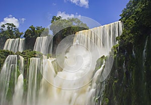 Iguazu waterfalls long exposure lid up by sun, Argentina