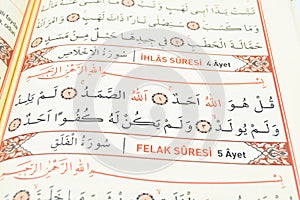 Ihlas and Felak from the Qur`an which is the last holy book