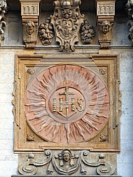 IHS sign on the facade of baroque church