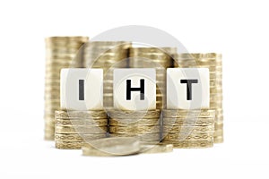 IHT (Inheritance Tax) on gold coins on white backg