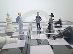 Iillustration for photo War, battle or politic situation concept, 2 standing mini figure, negoitation or debate beyond chess