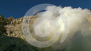 Ijen volcano or Kawah Ijen with the turquoise coloured acidic crater lake