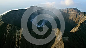 Ijen volcano or Kawah Ijen with the turquoise coloured acidic crater lake