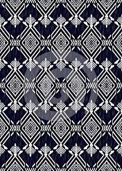 Ikat embroidery on dark blue background and white stripes geometric ethnic oriental seamless pattern