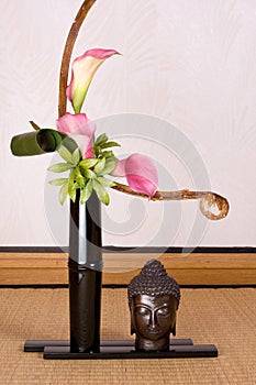 Ikebana and buddha photo