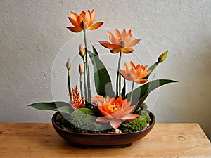 ikebana de flores de loto naranja generative AI photo