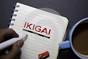 IKIGAI text on the book isolated on office desk background. Japanese concept