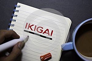 IKIGAI text on the book isolated on office desk background. Japanese concept photo